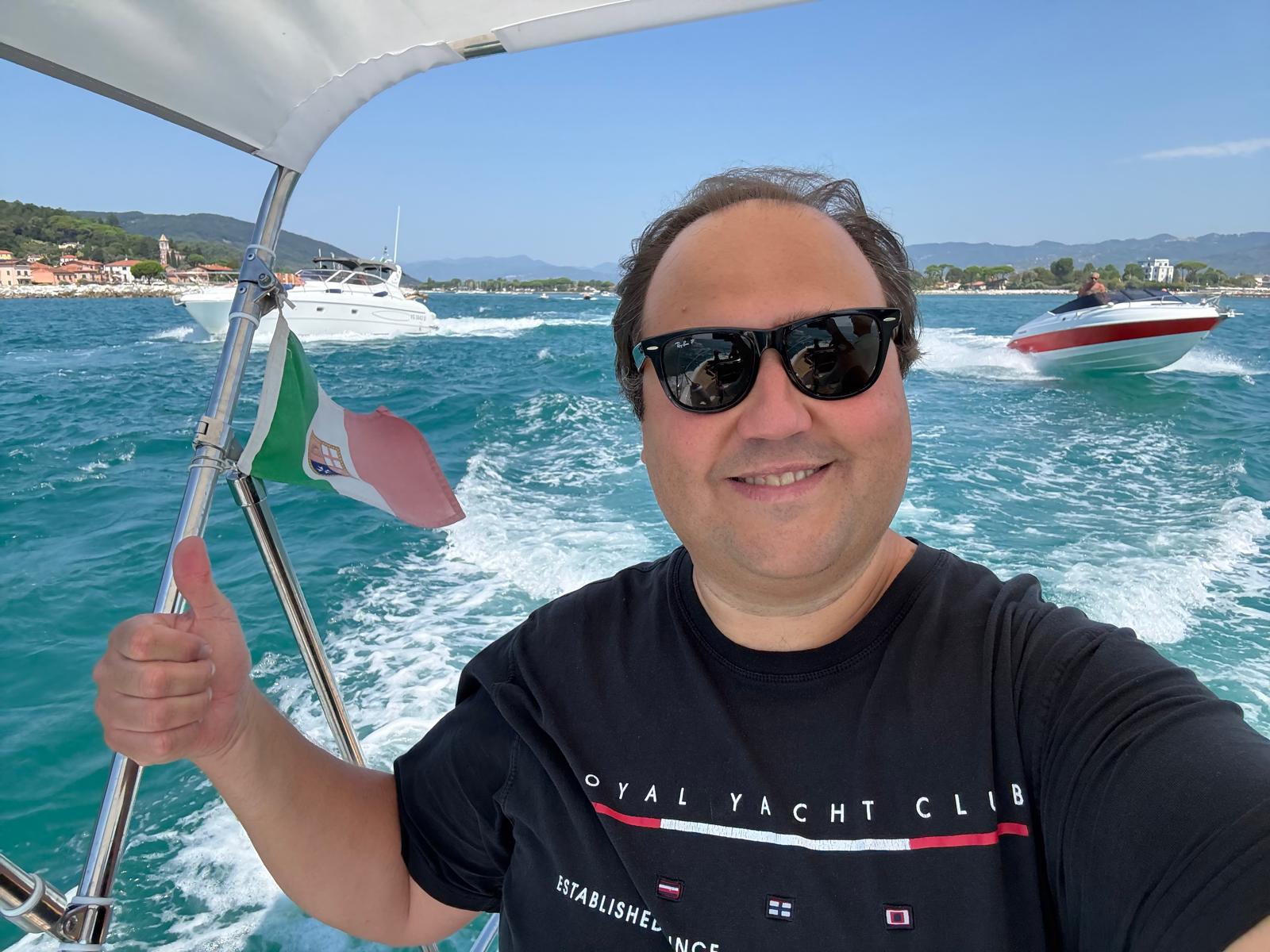 Andrea Angella on a boat off the Tuscan coast